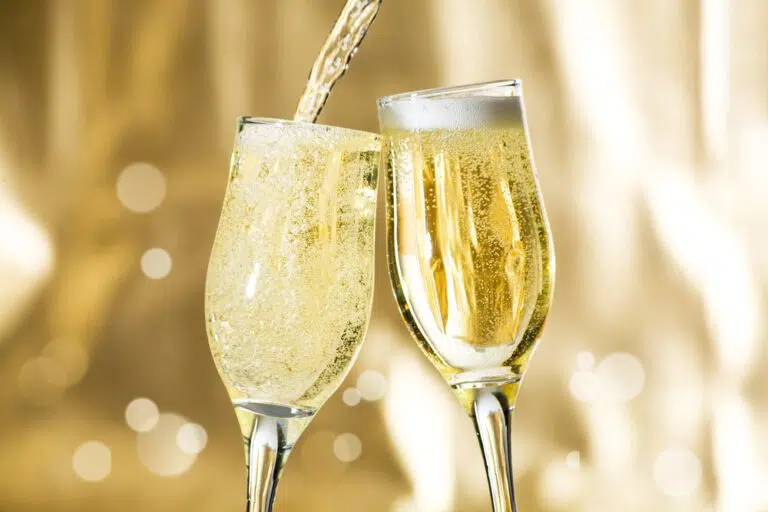 pouring sparkling wine in glasses