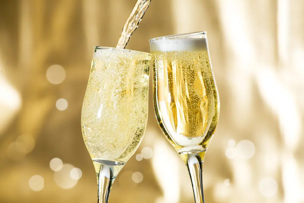pouring sparkling wine in glasses