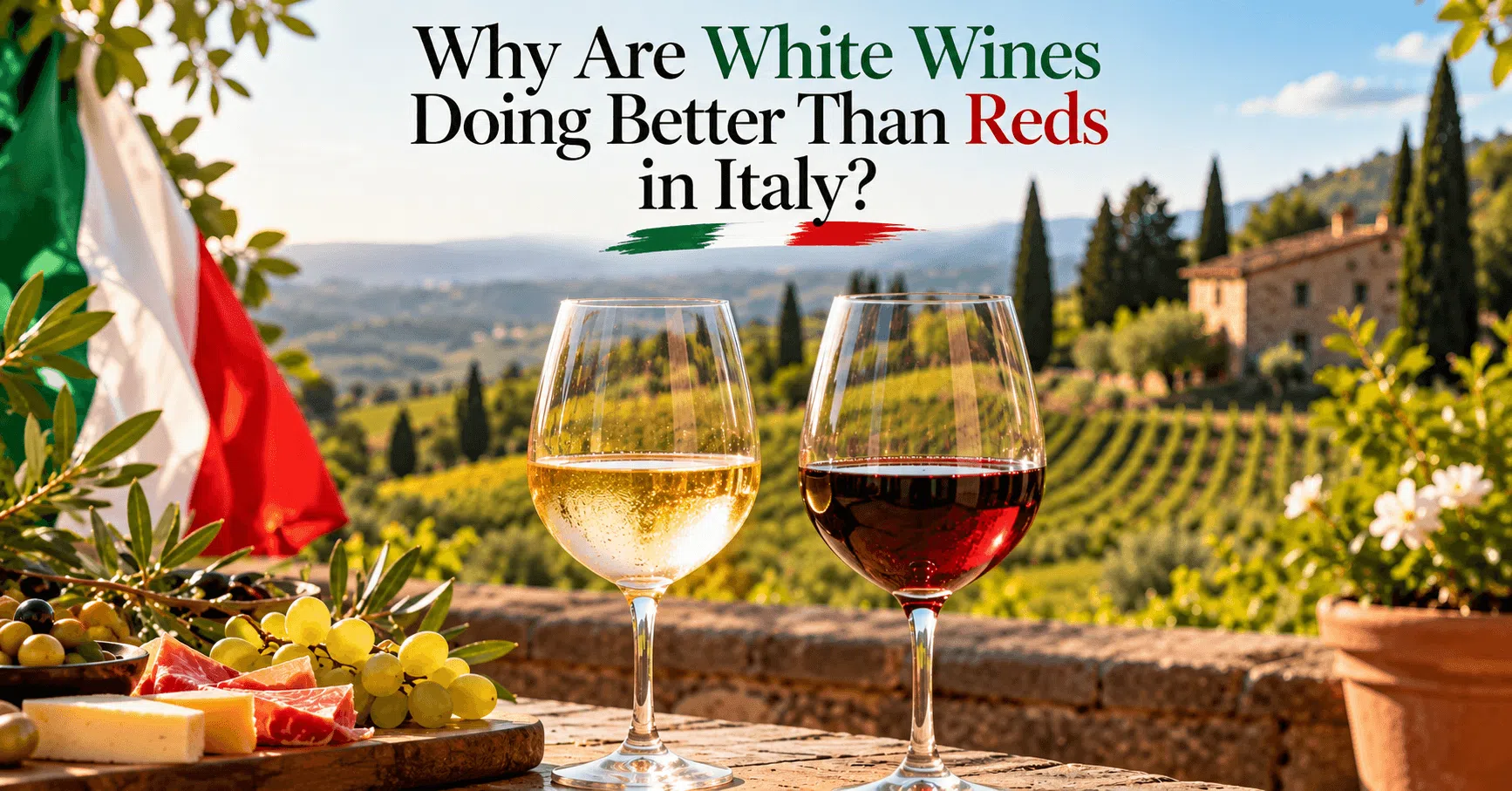 Glasses of white and red Italian wine beside an Italian flag on a vineyard terrace.